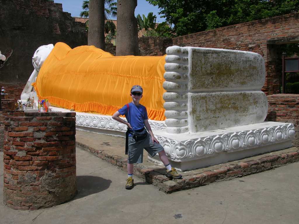 Bangkok 06 01 Ayutthaya Wat Lokaya Sutha Reclining Buddha Full View Next to Wat Yai Chai Mongkol, Wat Lokaya Sutha, constructed at an unknown date, was largely destroyed when the city of Ayutthaya fell to the Burmese in 1767. Its name means 